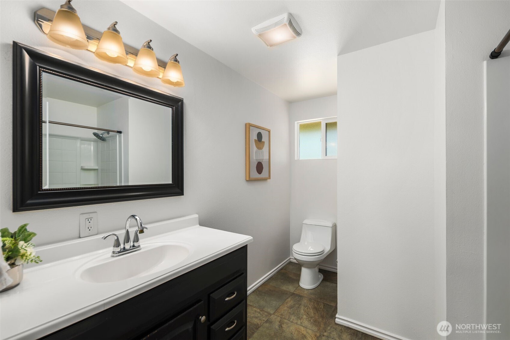 20101 95th Place Northeast Bothell, WA 98011 - Photo 11 of 37 a bathroom with a toilet a sink and a mirror