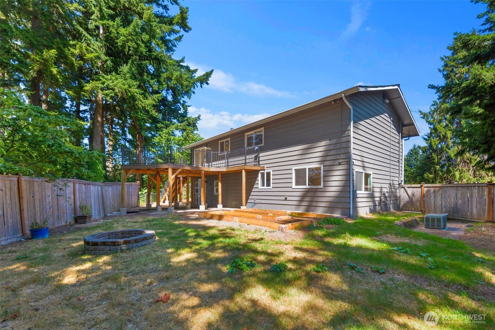 20101 95th Place Northeast Bothell, WA 98011 - Photo 18 of 37 a backyard of a house with table and chairs