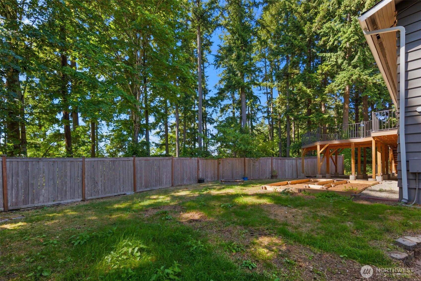 20101 95th Place Northeast Bothell, WA 98011 - Photo 19 of 37 a view of a backyard with a small cabin and wooden fence