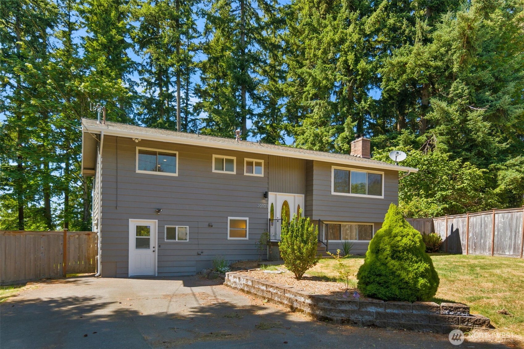20101 95th Place Northeast Bothell, WA 98011 - Photo 2 of 37 a front view of a house with a yard