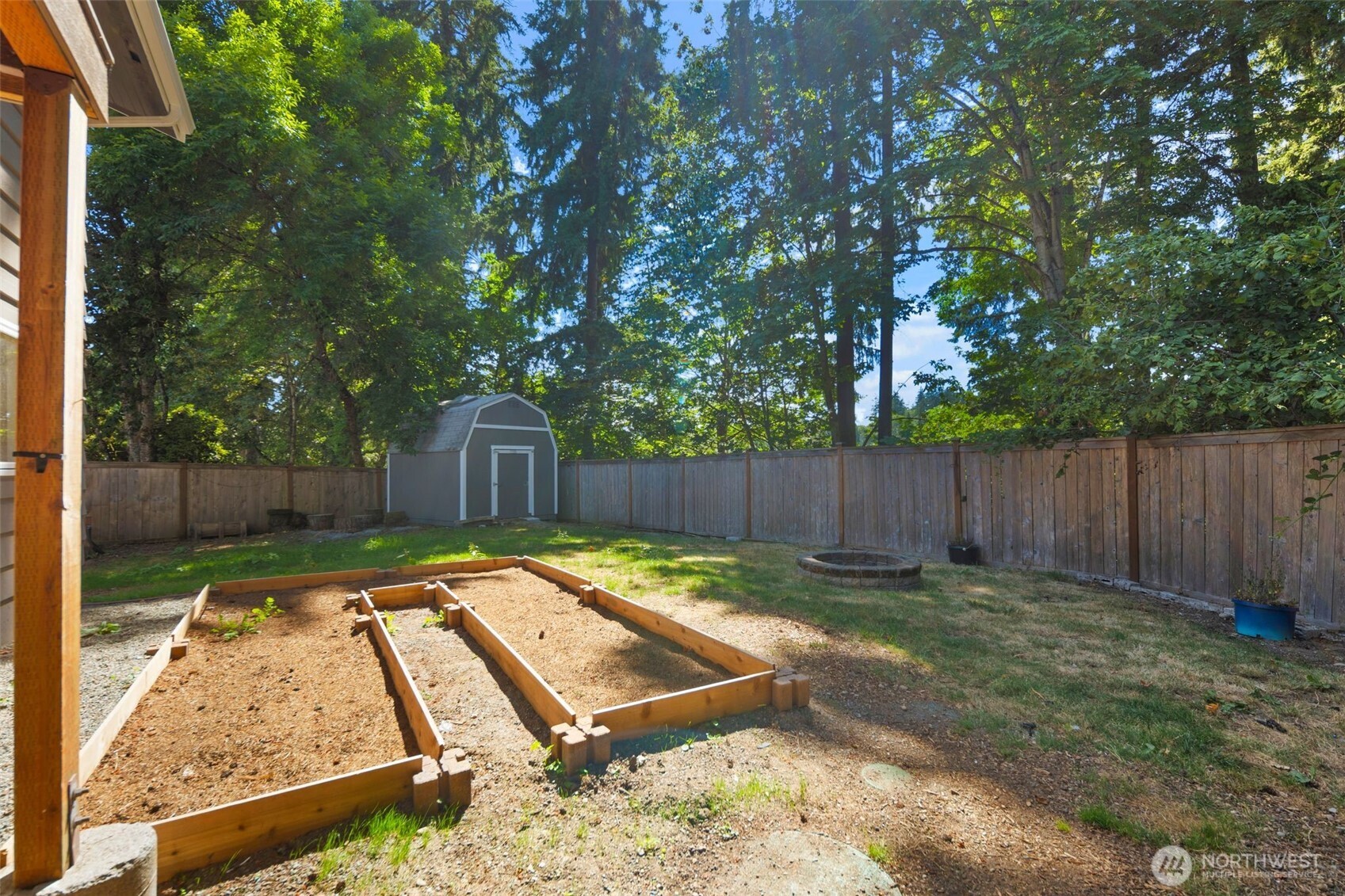 20101 95th Place Northeast Bothell, WA 98011 - Photo 24 of 37 a view of a backyard with wooden fence and a large tree