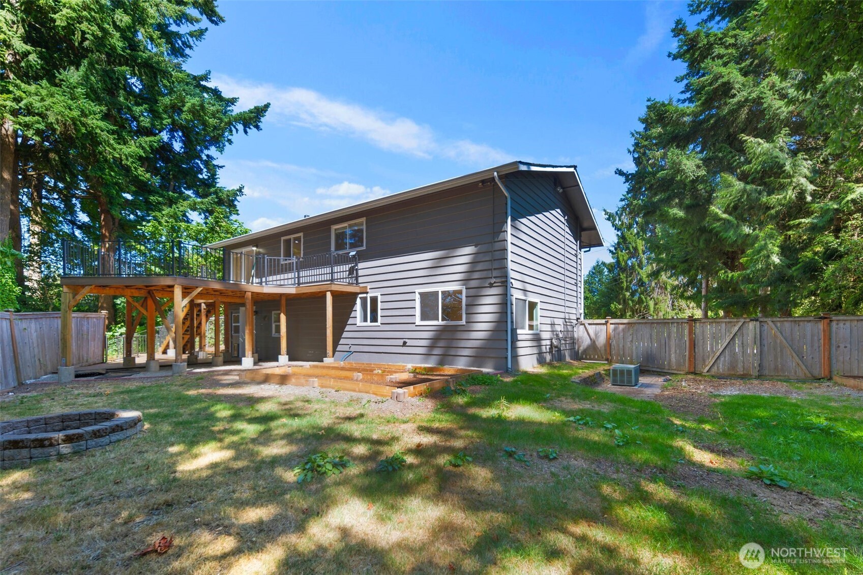 20101 95th Place Northeast Bothell, WA 98011 - Photo 25 of 37 a front view of house with a garden