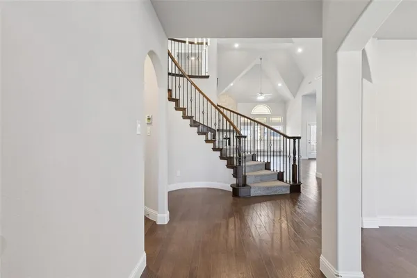 a view of entryway and hall with wooden floor