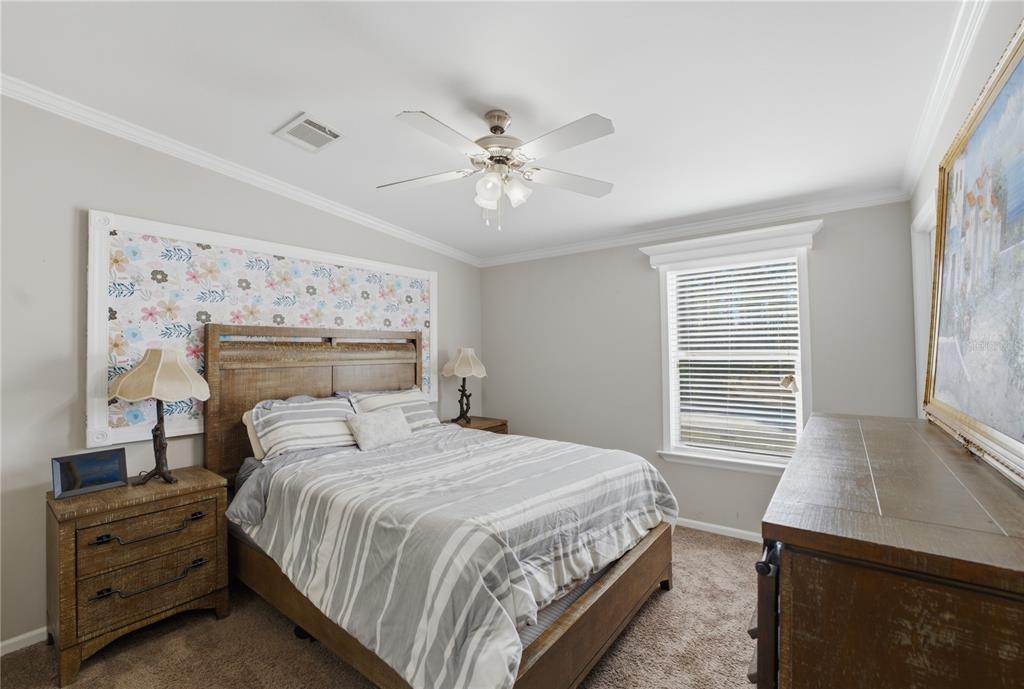 6844 Chad Jason Road St. Cloud, FL 34773 - Photo 37 of 59 a bedroom with a bed and a window