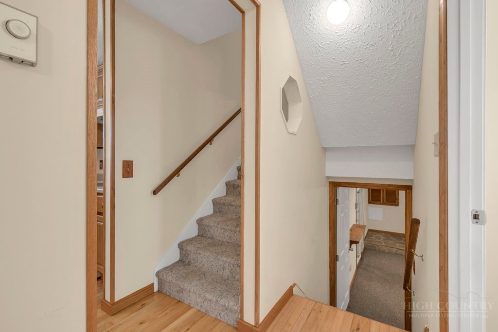 163 Rolling Hill Drive Boone, NC 28607 - Photo 13 of 40 a view of entryway and hall with wooden floor