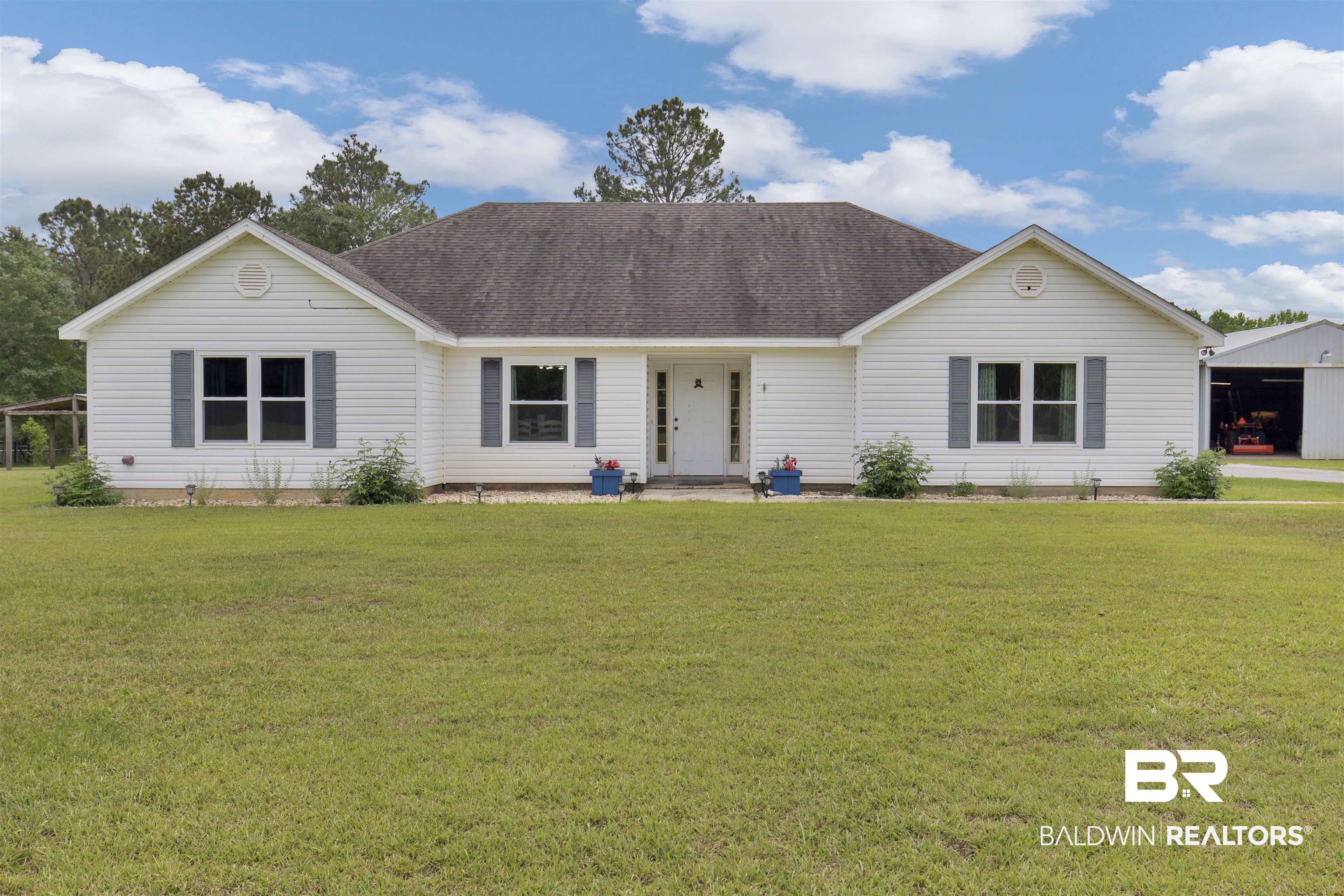 13925 Fort Lake Road Grand Bay, AL 36541 - Photo 1 of 37 Ranch-style home featuring a shingled roof and a front lawn