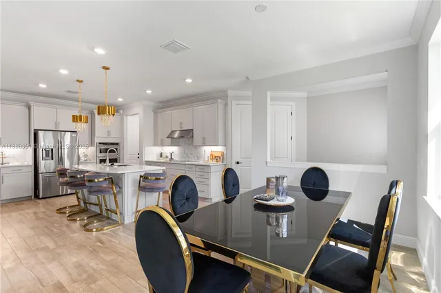 a view of a dining room with furniture window and outside view