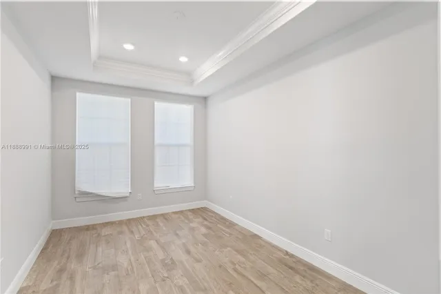 a view of a house with swimming pool and sitting area