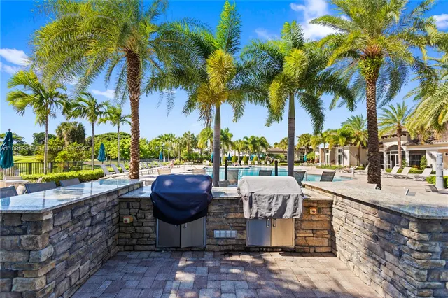 a view of house with outdoor space and sitting area