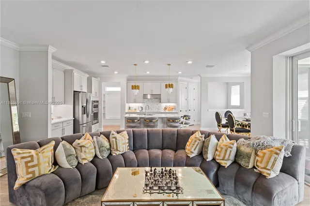 a living room with furniture a rug and a table