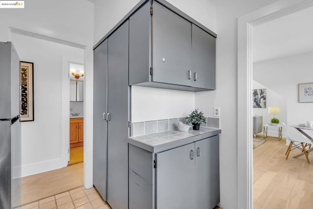 a kitchen with appliances and cabinets