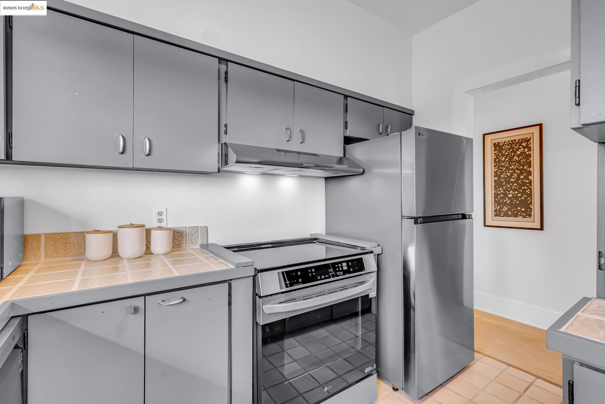 2907 Channing Way Berkeley, CA 94704 - Photo 18 of 26 a kitchen with appliances and cabinets