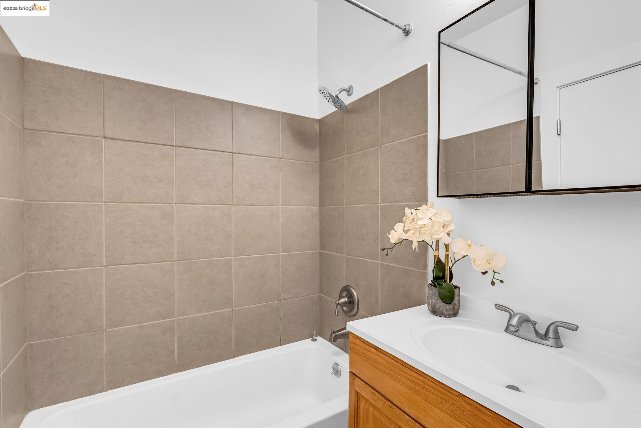 2907 Channing Way Berkeley, CA 94704 - Photo 21 of 26 a bathroom with a sink and a bathtub