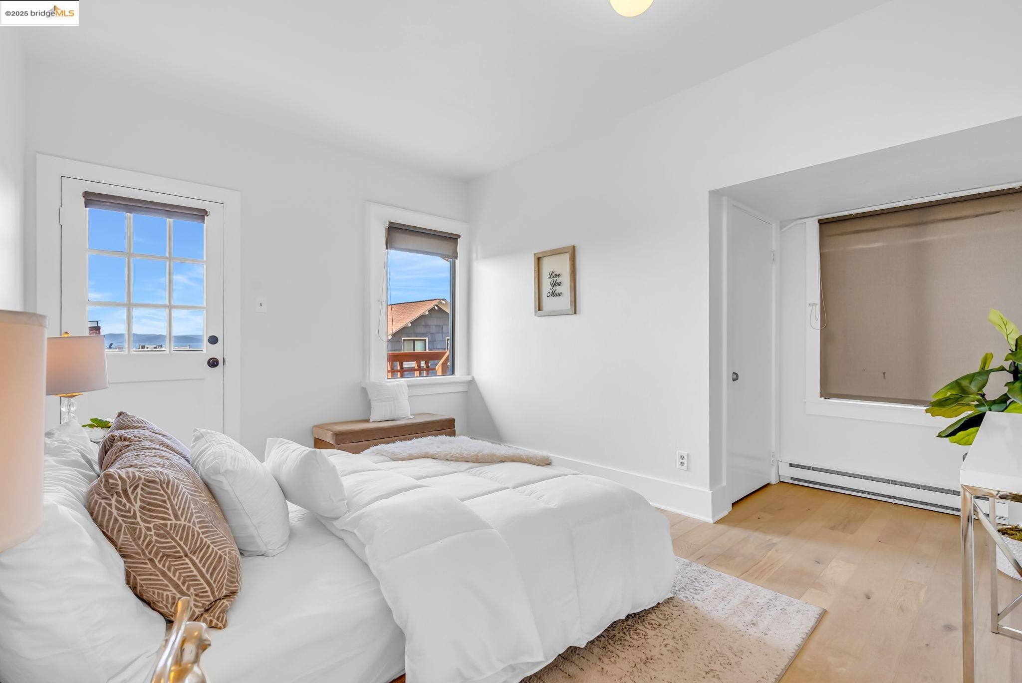 2907 Channing Way Berkeley, CA 94704 - Photo 22 of 26 a bedroom with a bed and hallway