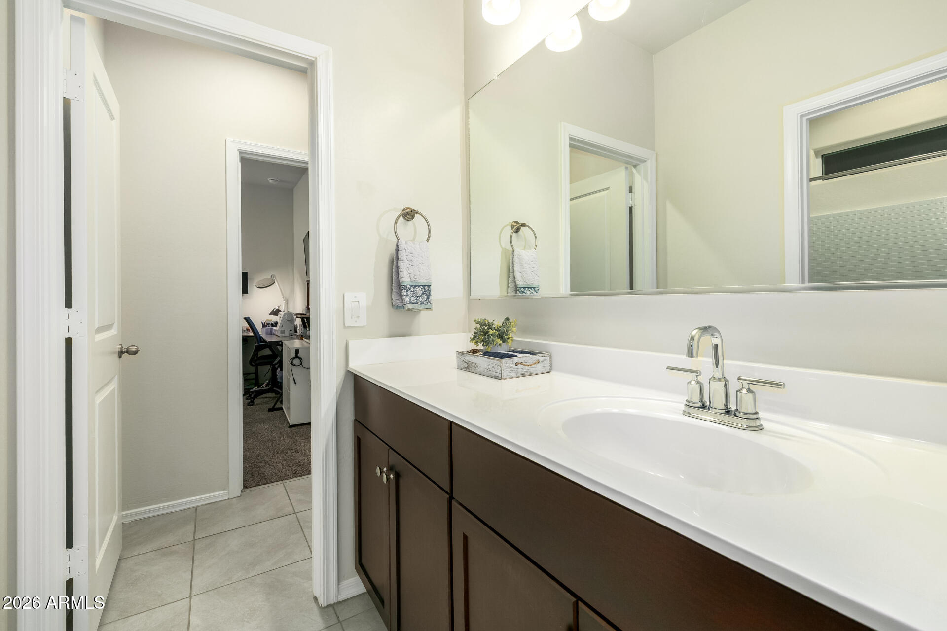 9471 Greenhouse Road Florence, AZ 85132 - Photo 16 of 22 a bathroom with a sink double vanity and a mirror