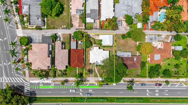 a kitchen with stainless steel appliances a stove microwave and cabinets
