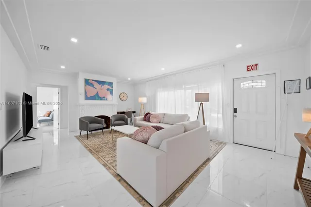 a living room with furniture and a rug