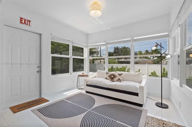 a living room with furniture and a table