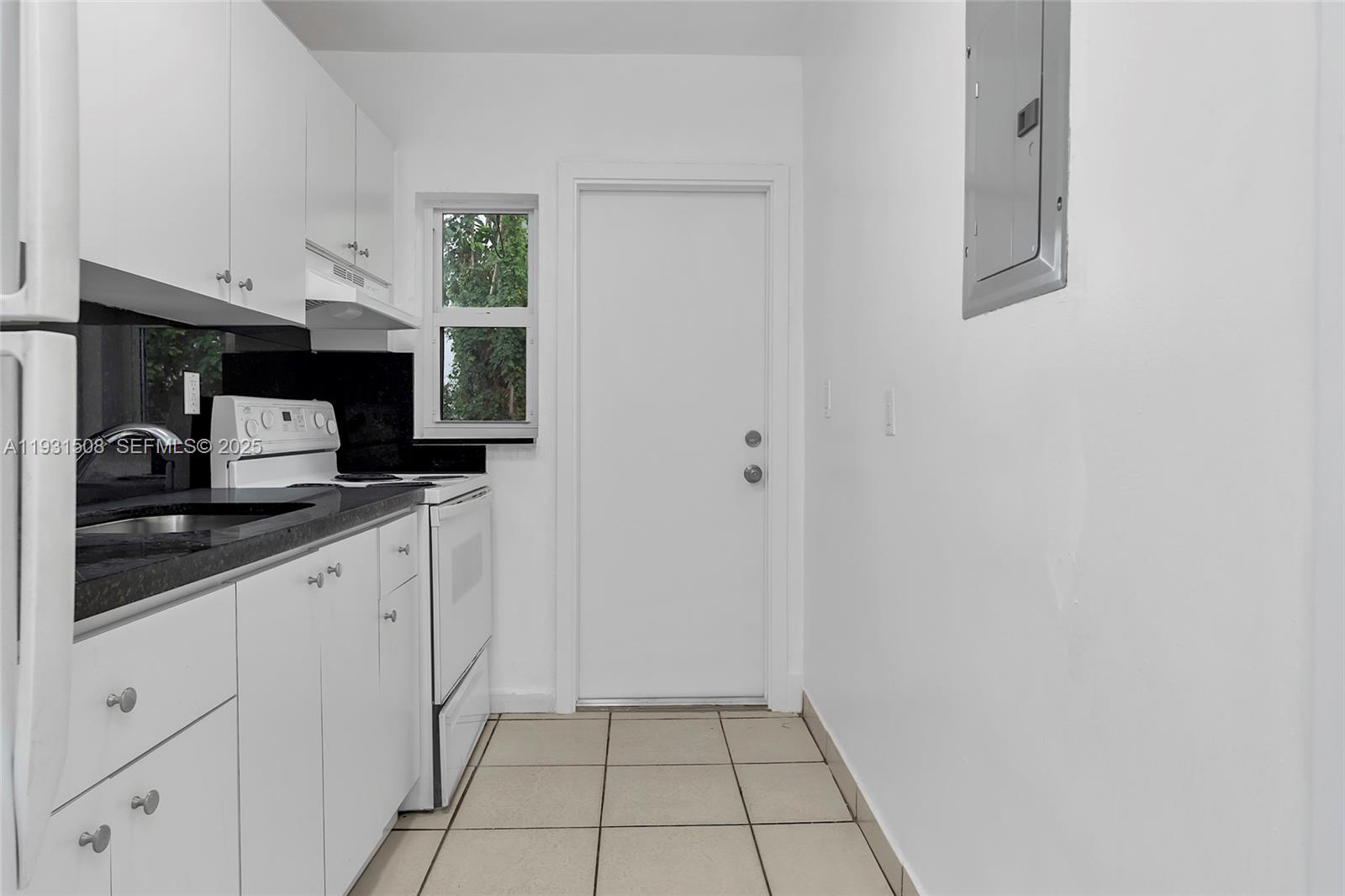 634 Southwest 10th Street, Unit 4 Miami, FL 33130 - Photo 11 of 19 a kitchen with a sink and cabinets