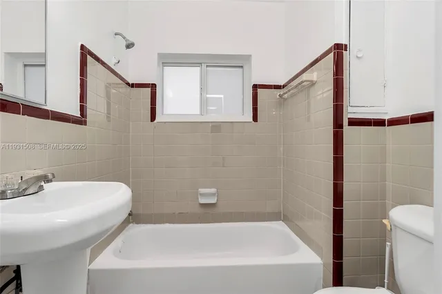a bathroom with a sink and a bathtub
