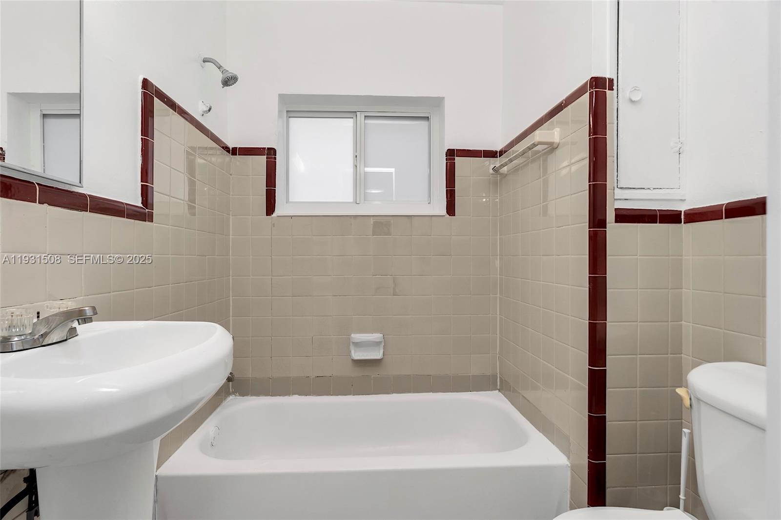 634 Southwest 10th Street, Unit 4 Miami, FL 33130 - Photo 14 of 19 a bathroom with a sink and a bathtub