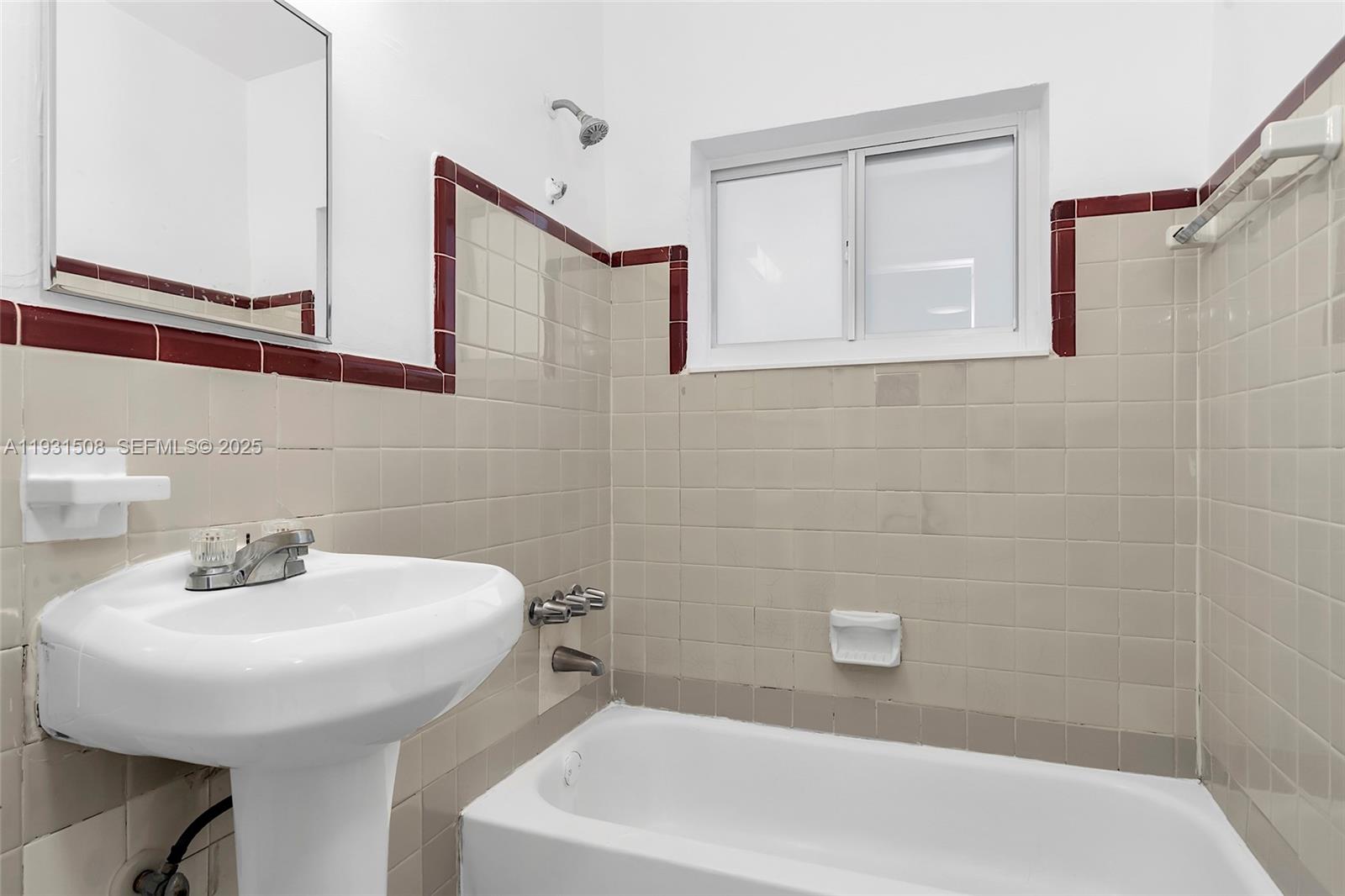 634 Southwest 10th Street, Unit 4 Miami, FL 33130 - Photo 15 of 19 a bathroom with a sink and a bathtub