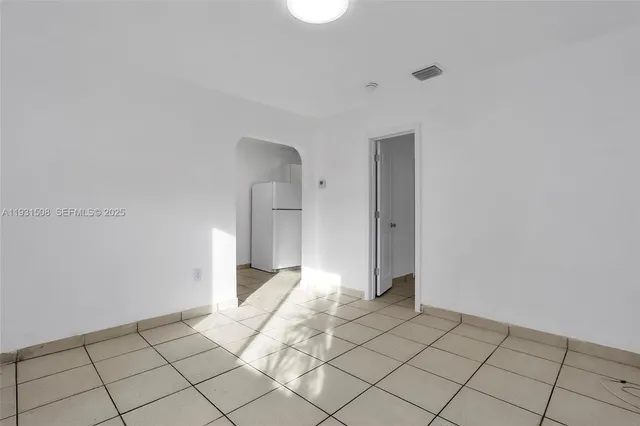 a view of an empty room and window