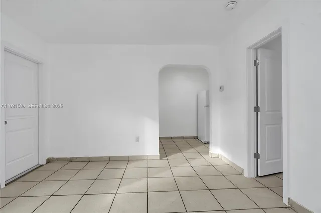 a view of an empty room and window