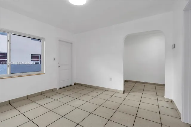 a view of an empty room and window