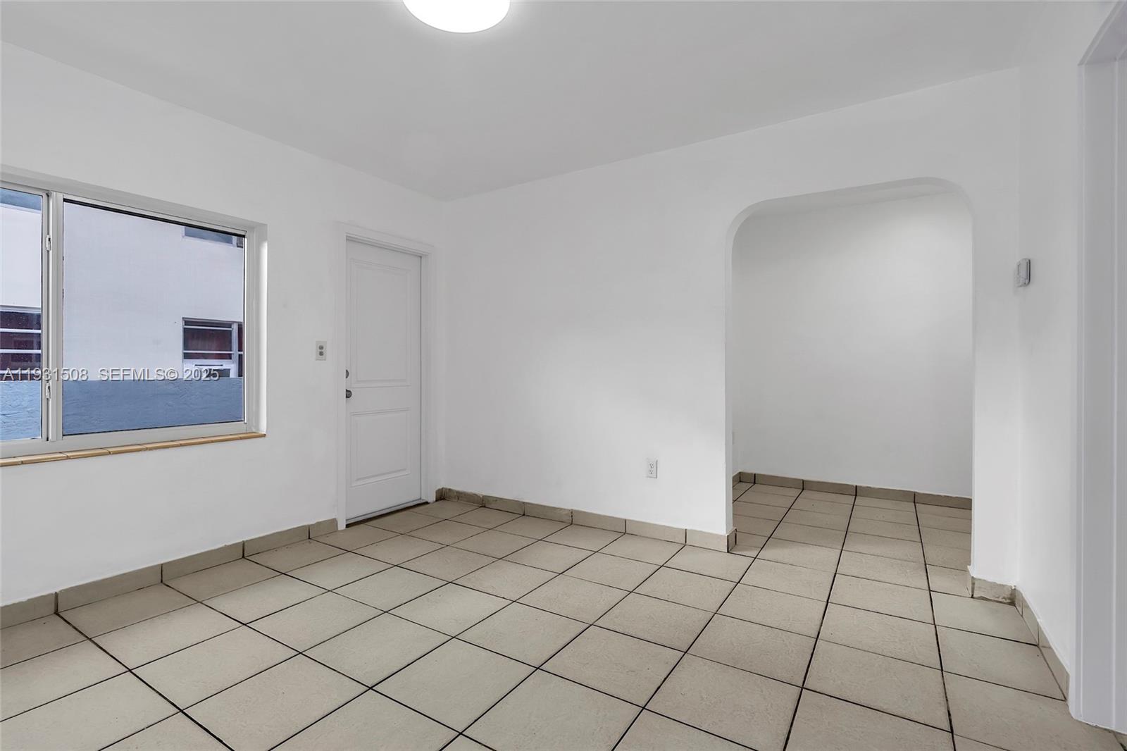 634 Southwest 10th Street, Unit 4 Miami, FL 33130 - Photo 7 of 19 a view of an empty room and window