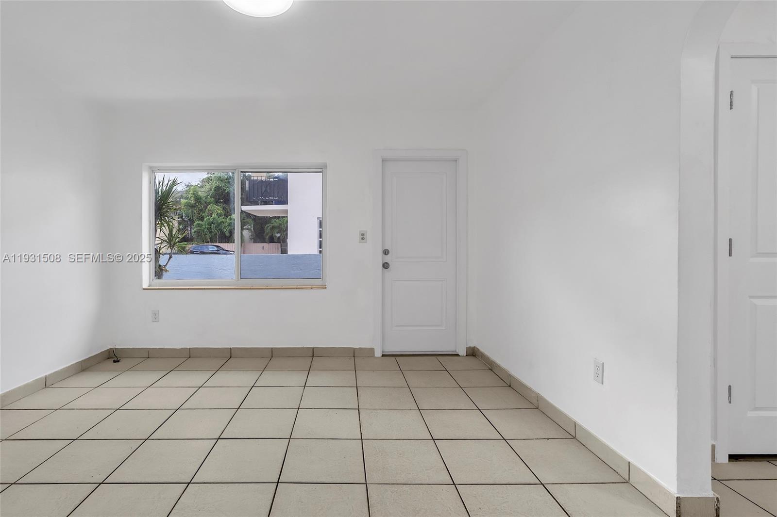 634 Southwest 10th Street, Unit 4 Miami, FL 33130 - Photo 8 of 19 an empty room with windows