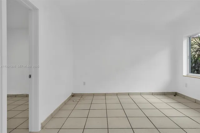 a view of an empty room and window