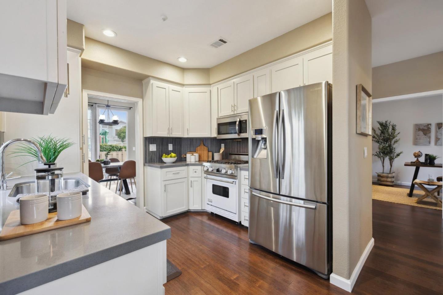 6 Outlook Circle Pacifica, CA 94044 - Photo 13 of 49 a kitchen with counter top space stainless steel appliances and wooden floor