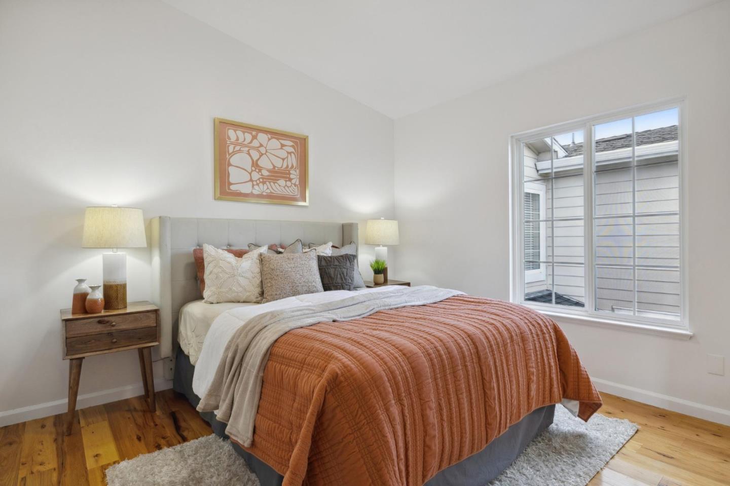 6 Outlook Circle Pacifica, CA 94044 - Photo 32 of 49 a bedroom with a bed and a lamp on table