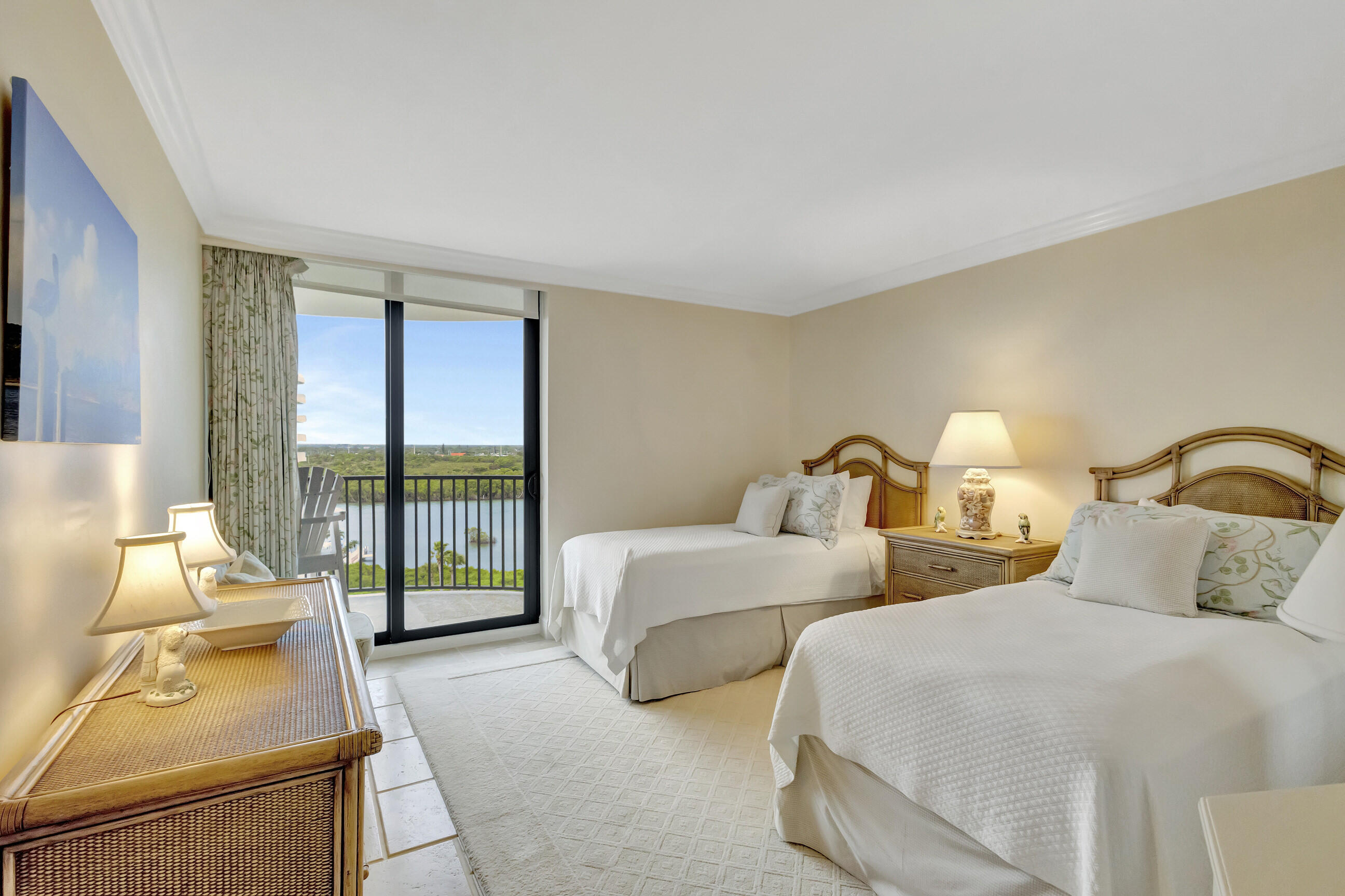 400 South Beach Road, Unit 804 Tequesta, FL 33469 - Photo 29 of 65 a bedroom with two beds and large window