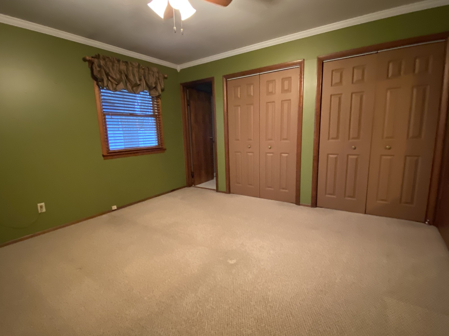 306 Andrew Street Dwight, IL 60420 - Photo 12 of 25 a view of a room with a bed and a chandelier fan