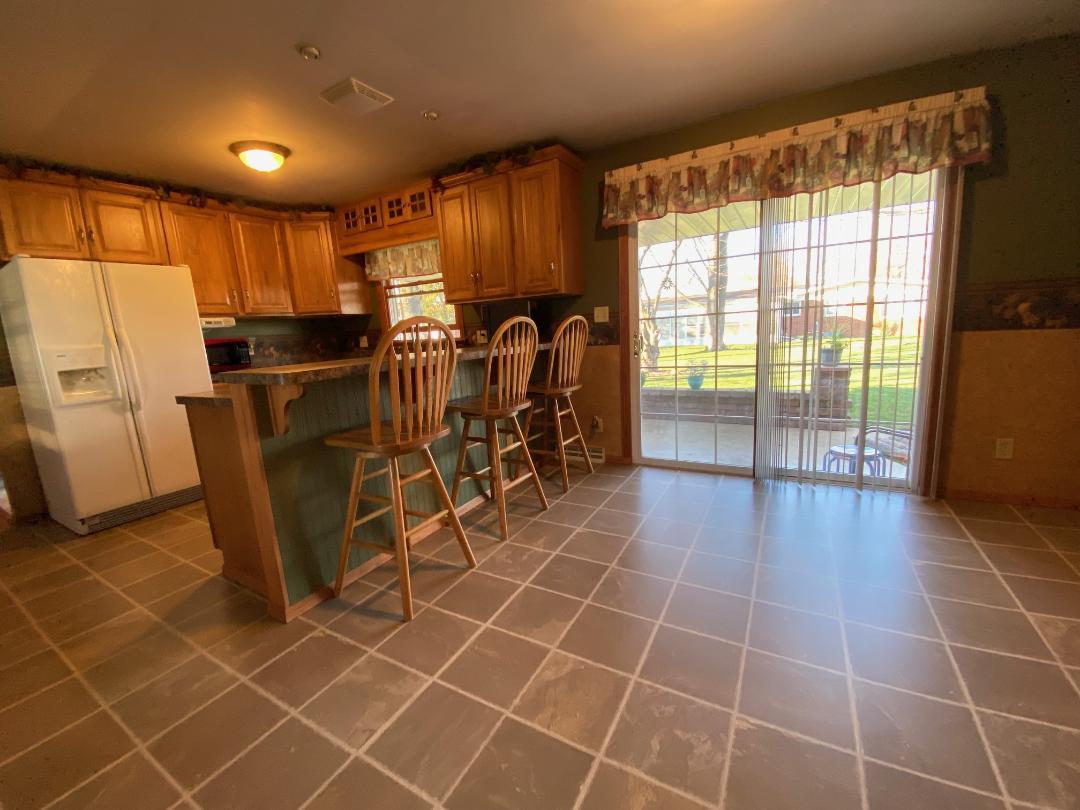 306 Andrew Street Dwight, IL 60420 - Photo 8 of 25 a view of a kitchen with furniture and staircase