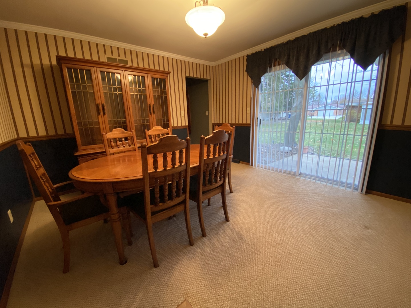 306 Andrew Street Dwight, IL 60420 - Photo 10 of 25 a view of a dining room with furniture and window
