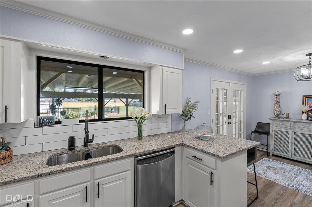 5505 Hickory Ridge Drive Bossier City, LA 71111 - Photo 12 of 36 a kitchen with a sink and large window