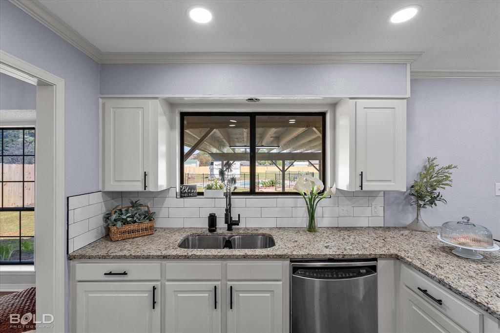 5505 Hickory Ridge Drive Bossier City, LA 71111 - Photo 13 of 36 a kitchen with granite countertop a sink and a window