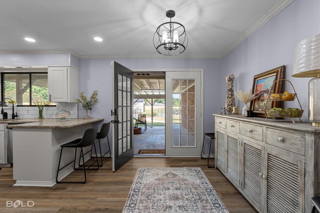 5505 Hickory Ridge Drive Bossier City, LA 71111 - Photo 16 of 36 a kitchen with stainless steel appliances granite countertop a sink and dishwasher a oven with white cabinets
