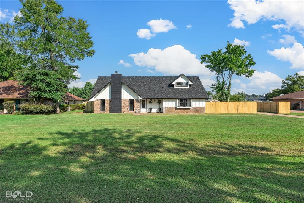 5505 Hickory Ridge Drive Bossier City, LA 71111 - Photo 26 of 36 a front view of a house with a yard