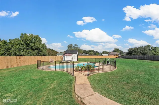 a view of a swimming pool with a patio