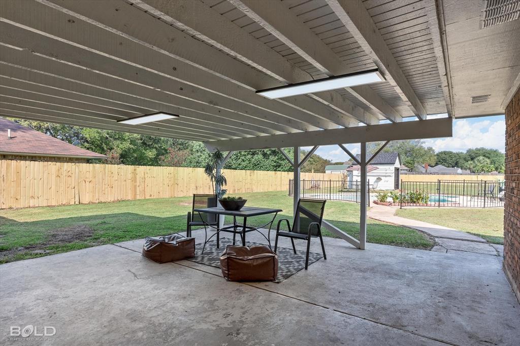 5505 Hickory Ridge Drive Bossier City, LA 71111 - Photo 5 of 36 a view of a yard with porch and outdoor seating