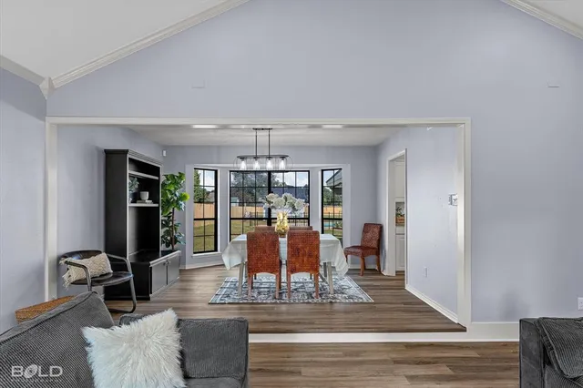 a view of a living room and chandelier
