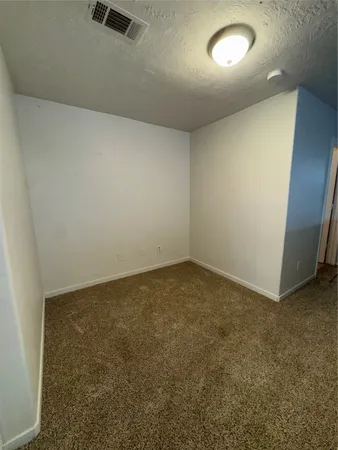 an empty room with a workbench