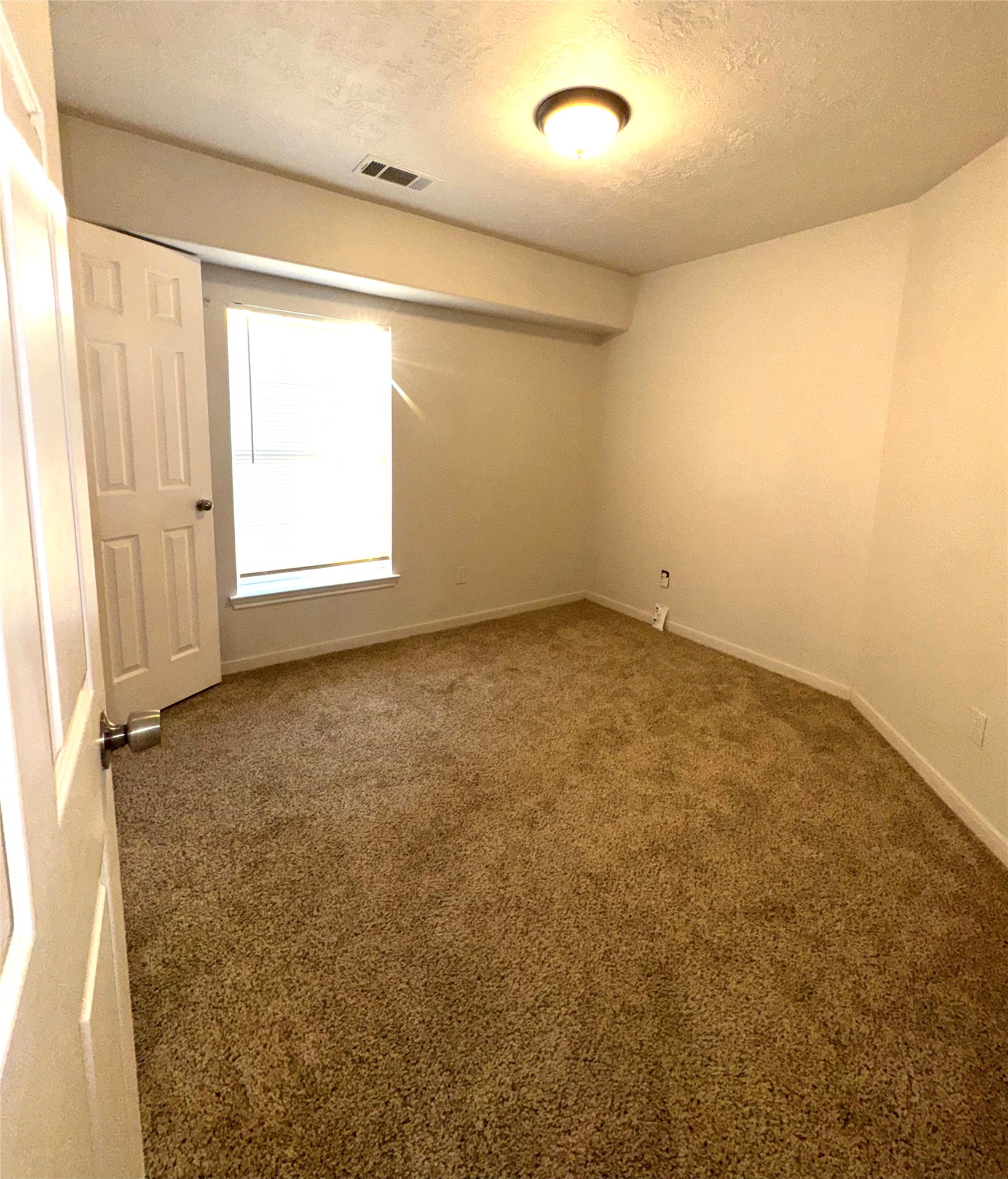 15931 Winston Point Lane Houston, TX 77084 - Photo 25 of 30 an empty room with a window