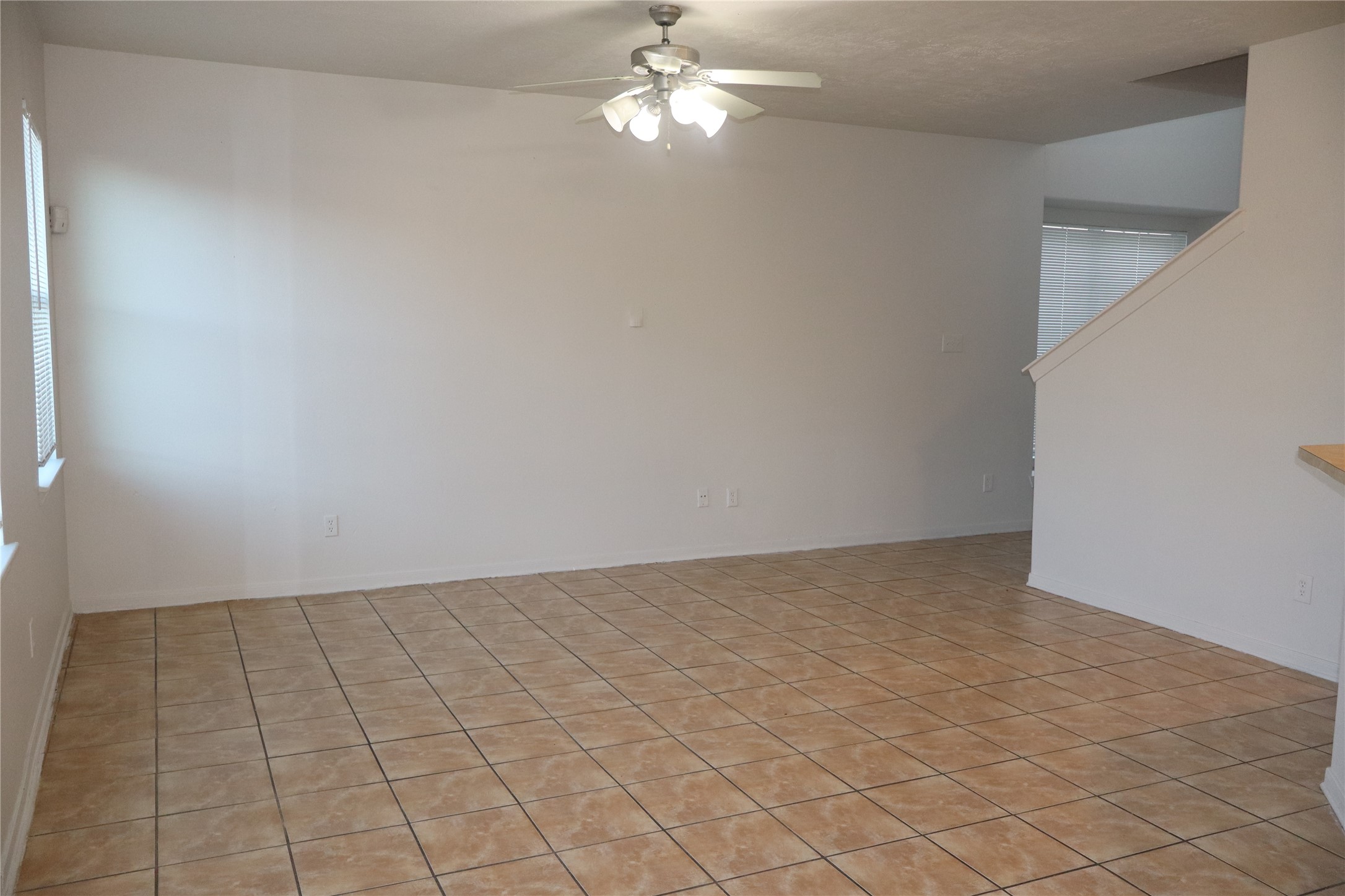15931 Winston Point Lane Houston, TX 77084 - Photo 8 of 30 a view of an empty room and chandelier fan