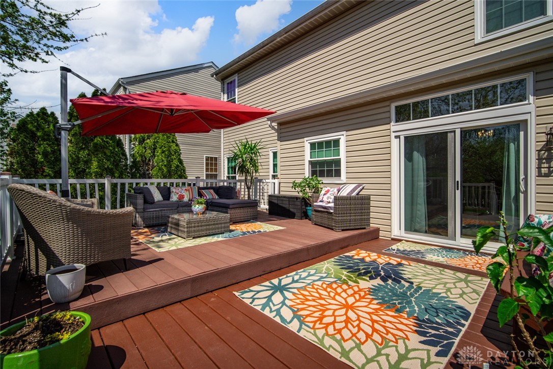 55 Janney Lane Springboro, OH 45066 - Photo 13 of 38 This spacious wooden deck offers an ideal setting for outdoor gatherings and relaxation.