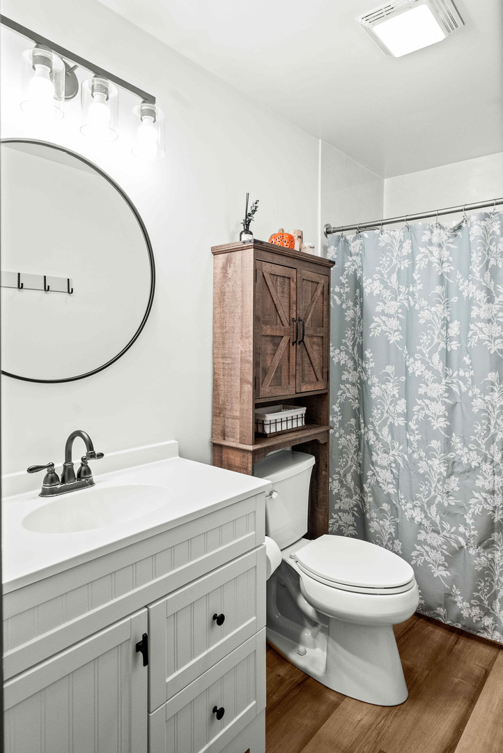 108 Cardinal Drive Le Roy, IL 61752 - Photo 17 of 33 a bathroom with a sink a toilet and a mirror
